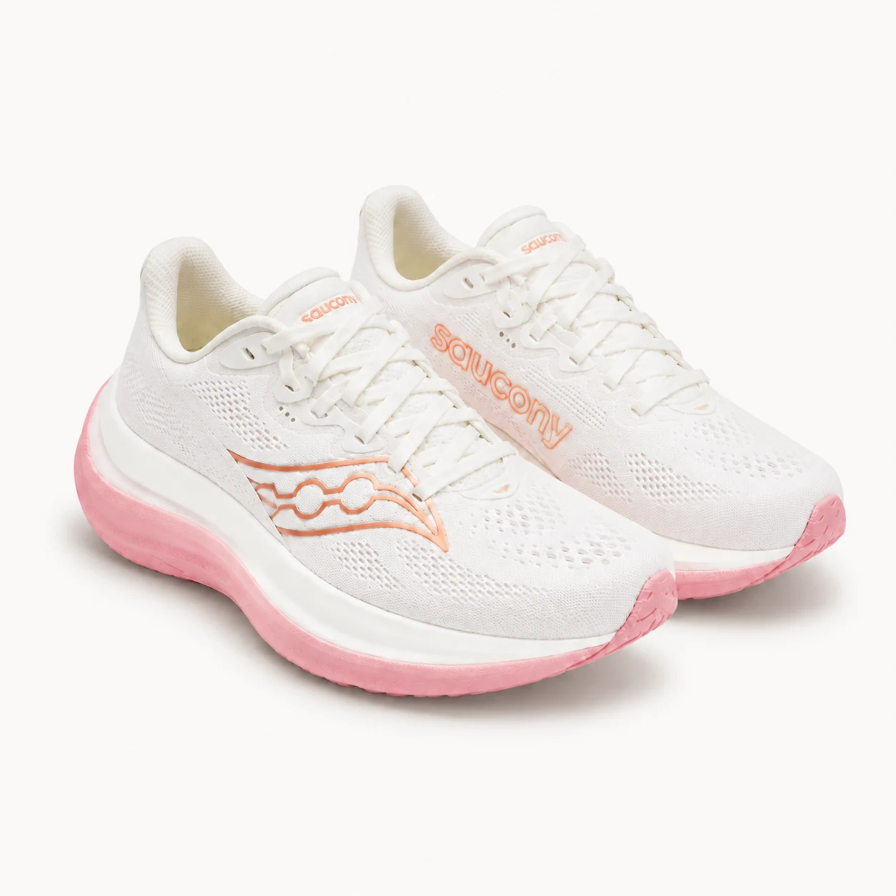 Par de tenis Saucony Ride 17 blancos con suela rosa